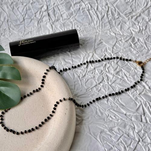 Black beads around necklace
